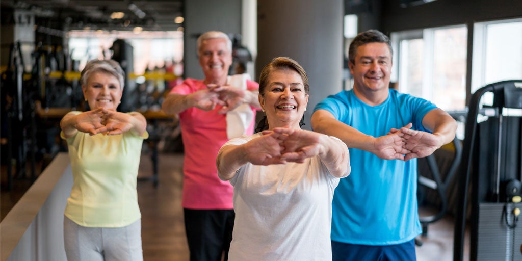 How to teach partner resistance band exercises for older adults and seniors  group fitness classes 