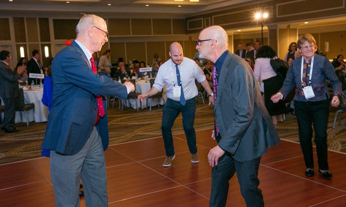 jim knickman and jim firman dancing at 2019 Age+Action Conference