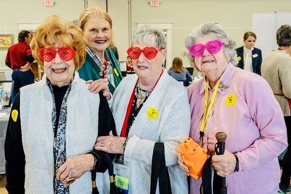 older ladies wearing heart-shaped glasses
