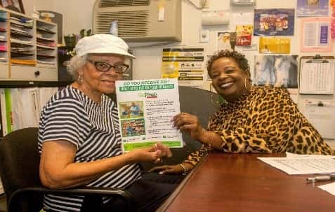 Dolores, one of the clients served by Watts Labor Community Action Committee, shares a smile with her counselor.