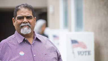 Older Hispanic man at polling location