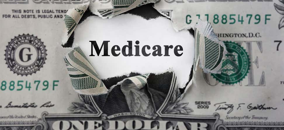 Medicare inside torn dollar bill