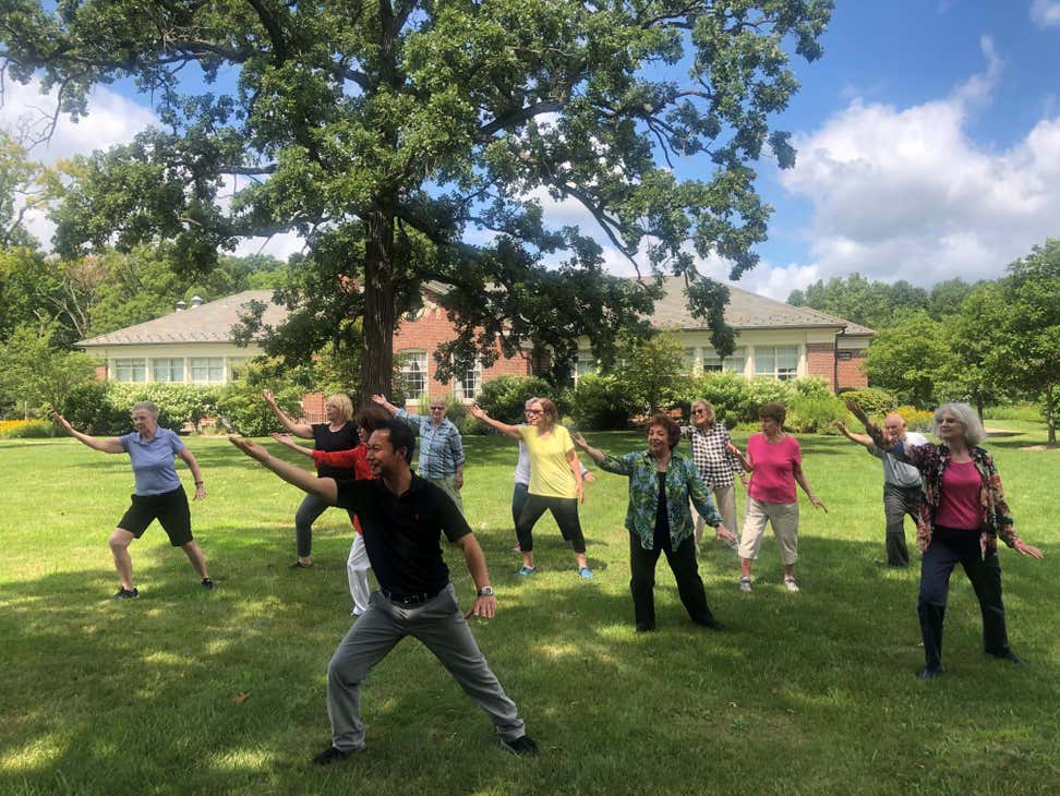 A group of seniors is practicing Tai Chi outside. NISC Photo Contest (image by Tara Purtell)